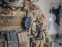 Military man with radio in pocket